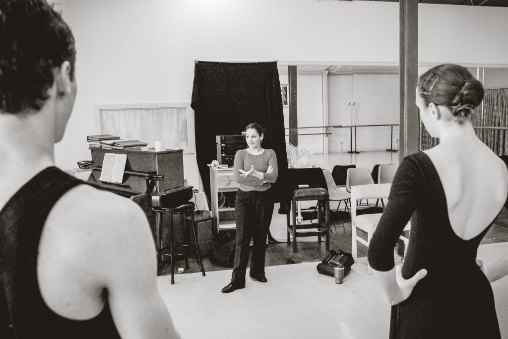 Dance instructor in class, captured by Arnold Szmerling for the Visual Life Collection, highlighting the theatrical artistry of stylized national dance.