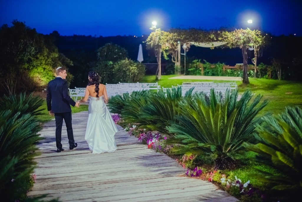 Spontaneous night moment of love and joy captured as iconic wedding photography by Arnold Szmerling, manifesting the enduring soul of the couple for the Visual Life Collection.