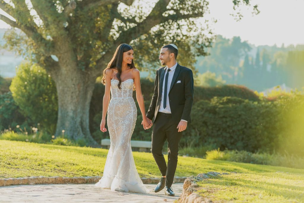 Spontaneous moment of laughter and kinetic joy at the presidents residence captured as iconic wedding photography by Arnold Szmerling, manifesting the enduring soul of the couple for the Visual Life Collection.