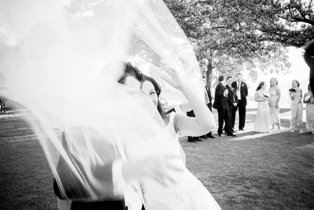 A moment of laughter and love in Sydney, captured as iconic wedding photography by Arnold Szmerling, manifesting the enduring soul of the couple for the Visual Life Collection.