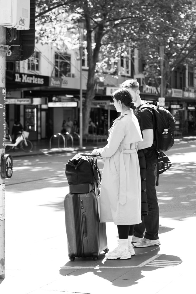 A young tourist couple visit Melbourne, a work of passion by Arnold Szmerling captured in Black and White during his Leica Q3 street photography experience. 
