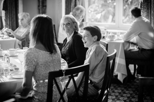 A candid moment in black and white of a bar mitzvah boy having breakfast captured as a fine art manifestation by Arnold Szmerling during an exclusive collaboration with the King David Jerusalem for the Visual Life Collection.