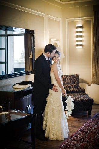 A warm embrace of the groom and bride in their suite with art deco style captured as a fine art manifestation by Arnold Szmerling during an exclusive collaboration with the King David Jerusalem for the Visual Life Collection.