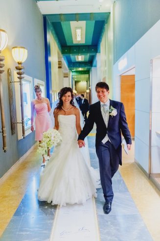 The Bride and Groom walking together down the iconic signature walkway captured as a fine art manifestation by Arnold Szmerling during an exclusive collaboration with the King David Jerusalem for the Visual Life Collection.