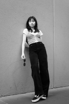 Kobowonderland model leaning against the wall with attitude in Black and White, captured with the Leica Q3 43, a work of passion by Arnold Szmerling for the Visual Life Collection focusing on lifestyle legacy portraiture. 